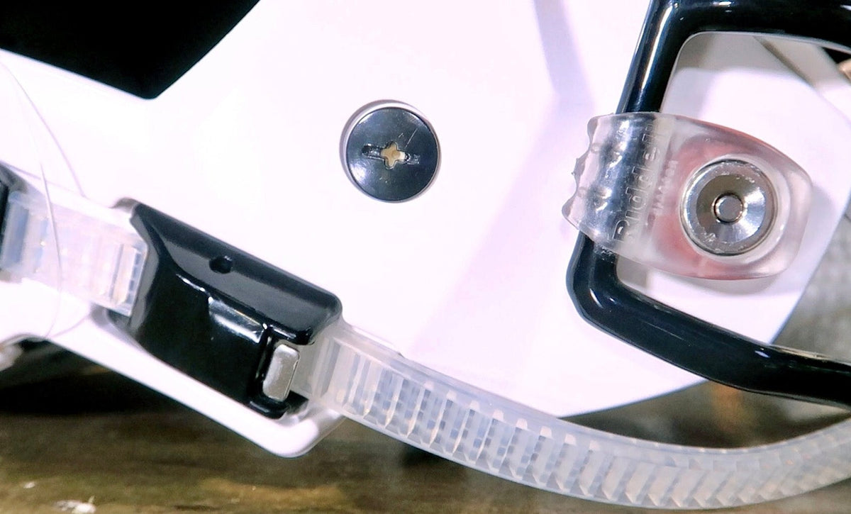 Bladder valve screw installed on a Riddell SpeedFlex shell, shown in black